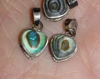 Three abalone and silver little necklace pendants or bracelet charms, gleaming in colour