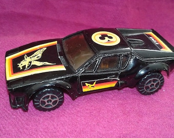 Eagle sports toy car, painted in black with red and  yellow details