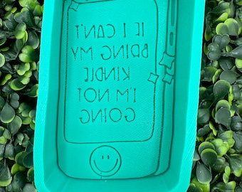 May include: Green silicone mold shaped like a smartphone with the text "I'm going to be kind, I can't  bring my  yummy" inside the screen and a smiley face at the bottom.