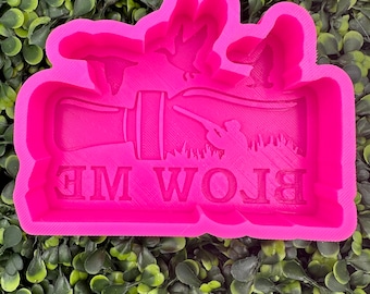 May include: Pink silicone mold for making a cake or cookie with the words "Blow Me" and a silhouette of a hunter with a shotgun and ducks flying overhead.