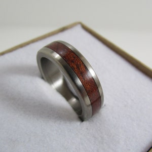 Bubinga wood ring with Titanium core.