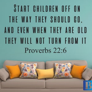 May include: A teal wall with a black and white inspirational quote that reads "Start children off on the way they should go, and even when they are old they will not turn from it. Proverbs 22:6". A light brown sofa with yellow and floral patterned throw cushions is in front of the wall. A white bedside table with two drawers is to the right of the sofa.