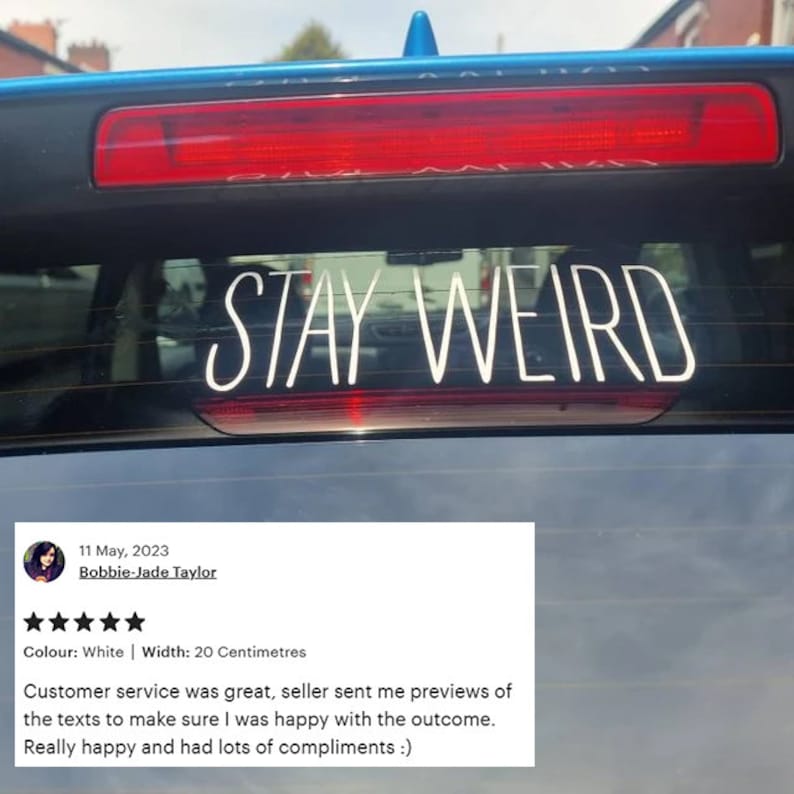 May include: A white vinyl car sticker with the text "STAY WEIRD" on a blue car. The sticker is 20 inches wide.