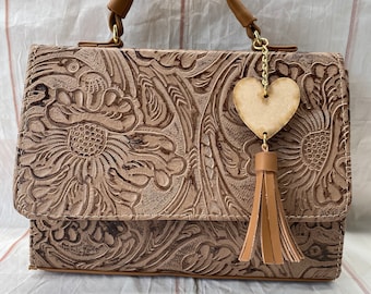 beige tooled leather crossbody bag