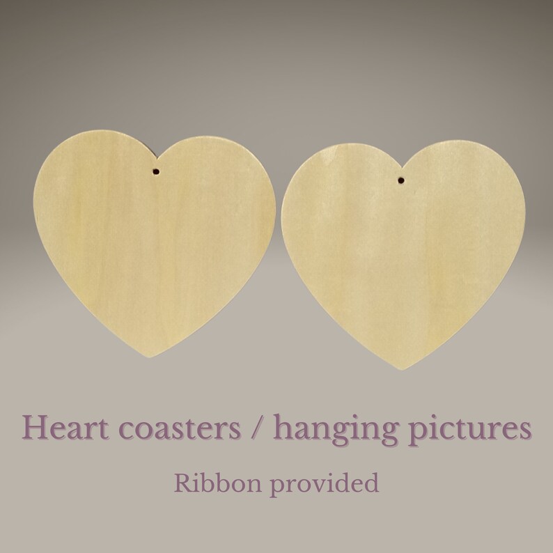 May include: Two unfinished wooden heart-shaped coasters or hanging pictures. Each heart has a hole for hanging and comes with a ribbon.
