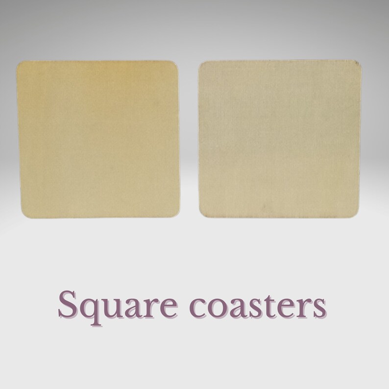 May include: Two square beige coasters. The coasters are made of a textured material and have a slightly rough surface.