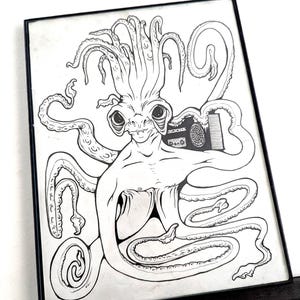 May include: Framed black and white illustration of an octopus-like creature with a boombox. The artwork features detailed linework, with the creature's tentacles and body prominently displayed. The boombox is on the creature's shoulder.