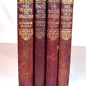 Four Book Stack. Dumas. (1920s) Illustrated small leather antiquarian books. Decorated Spine. Instant library. Vicomte de Bragalonne