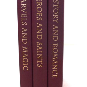 May include: Three hardcover books with burgundy covers and gold lettering. Titles include "Marvels and Magic", "Heroes and Saints", and "History and Romance". Each book features a gold emblem at the bottom.