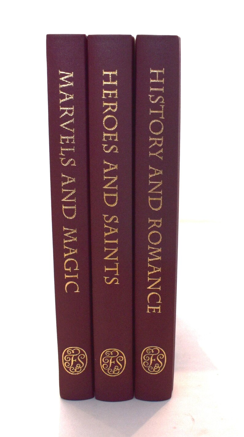 May include: Three hardcover books with burgundy covers and gold lettering. Titles include "Marvels and Magic", "Heroes and Saints", and "History and Romance". Each book features a gold emblem at the bottom.