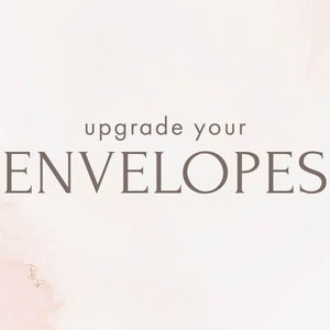 May include: A light background with a watercolor effect and the text "upgrade your ENVELOPES" in a dark gray serif font. The text is centered, with "upgrade your" above "ENVELOPES". The background has soft pink and gold accents.