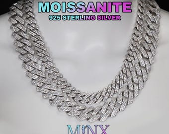 May include: A dazzling silver moissanite necklace with a cuban link design. The necklace is made of 925 sterling silver and is displayed on a mannequin. The image includes the text "MOISSANITE" and "925 STERLING SILVER". The brand "MNX LONDON" is also visible.