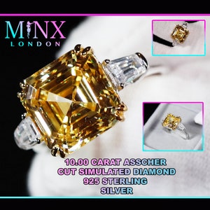 May include: A 10.00 carat asscher cut simulated diamond ring in sterling silver. The ring features a large, yellow, square-shaped diamond with smaller diamonds on the band.
