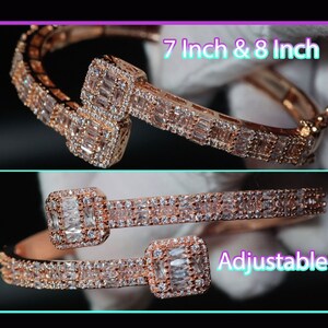 May include: A rose gold bangle bracelet with a double row of baguette-shaped cubic zirconia stones. The bracelet is adjustable and comes in 7 inch and 8 inch sizes.