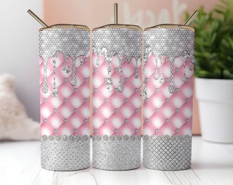May include: Three stainless steel tumblers with a pink and silver design. The tumblers have a diamond pattern with silver glitter and a pink quilted design. The silver glitter is dripping down the tumblers.