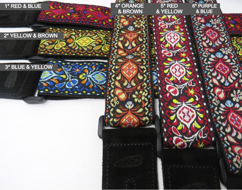 May include: Six guitar straps with different colored embroidered patterns. The straps are labeled with numbers and colors, such as "1* Red & Blue", "2* Yellow & Brown", "3* Blue & Yellow", "4* Orange & Brown", "5* Red & Yellow", and "6* Purple & Blue".