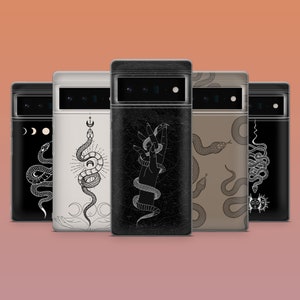 May include: A collection of phone cases with various snake and celestial designs. The cases feature black, beige, and brown backgrounds with white and black illustrations of snakes, moons, and hands. The cases are displayed against a peach background.