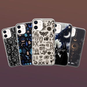 May include: A selection of phone cases with occult-themed designs. The cases feature illustrations of moons, stars, hands, moths, and other mystical symbols in black and white, and blue hues. The cases are made of clear plastic.