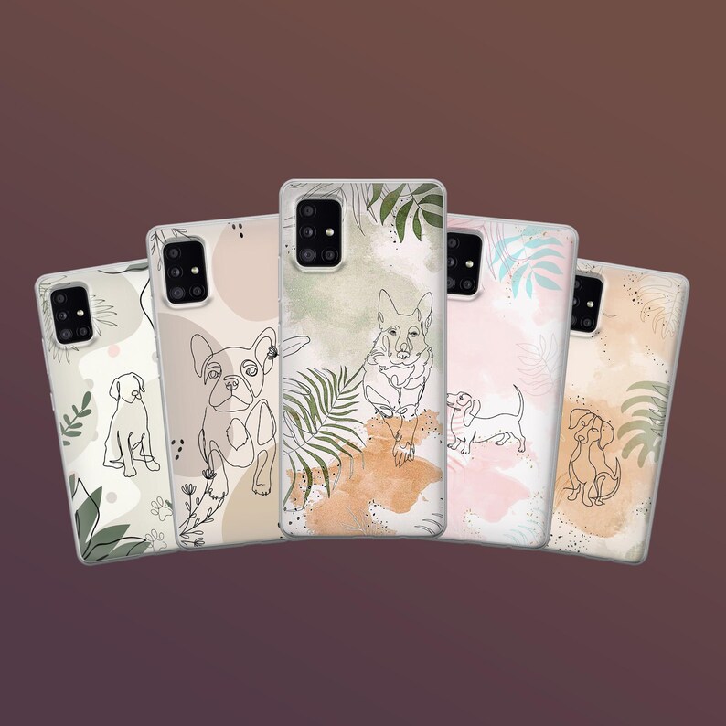 May include: Five phone cases with dog illustrations. Each case features a different dog breed in a line art style, with watercolor-style backgrounds in shades of beige, pink, and green. The cases are arranged in a fan shape against a brown background.