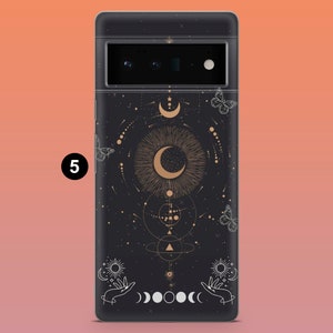 May include: Black phone case with a celestial design featuring a crescent moon, stars, butterflies, and hands. The case has a matte finish and a camera cutout at the top. The design is in gold and white against a black background.