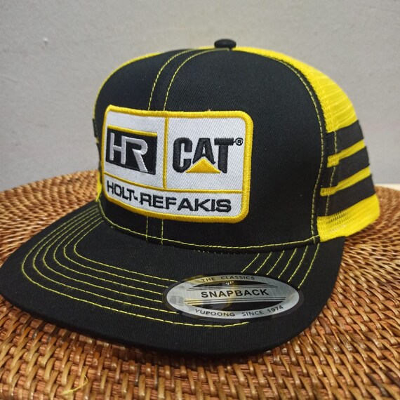CAT Holt Refakis Logo Patch Trucker Hat 