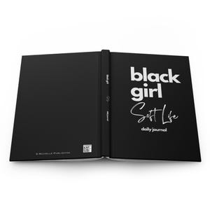 May include: Black journal with the text "black girl Soft Life daily journal" on the cover.