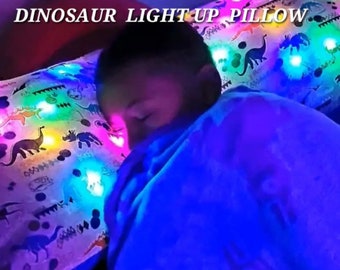 Almohada luminosa de dinosaurio con control remoto LED para decoración de habitación infantil