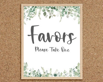 May include: A white sign with a wooden frame and a green eucalyptus border. The sign says "Favors Please Take One".
