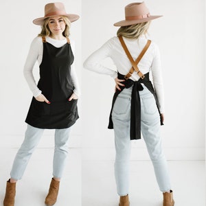 Customizable cross back apron with adjustable vegan leather straps.