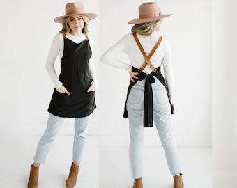 Customizable cross back apron with adjustable vegan leather straps.