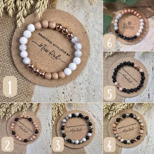 May include: Six beaded bracelets displayed on circular cards labelled with the text HANDMADE WITH LOVE BY Miss Roh. The bracelets feature various combinations of white lava, black lava, dalmatian jasper, rose gold, and natural wood beads.