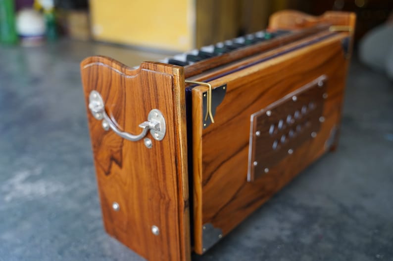 Dolphin Harmonium 2.5 Octave, 32 Keys, Portable Hand Pumped Kirtan Instrument, Teak Wood with Carry Case | Mayapurstore image 5