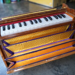 Dolphin Harmonium 2.5 Octave, 32 Keys, Portable Hand Pumped Kirtan Instrument, Teak Wood with Carry Case | Mayapurstore image 13
