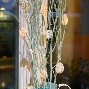 Set of 10 mini ceramic Easter eggs and flowers.