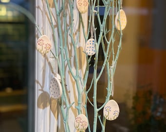 Set of 10 mini ceramic Easter eggs and flowers.