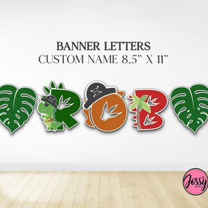 May include: A green, red, orange and brown dinosaur themed banner with the letters "ROAR" in a pirate theme. The letters are 8.5 inches by 11 inches.
