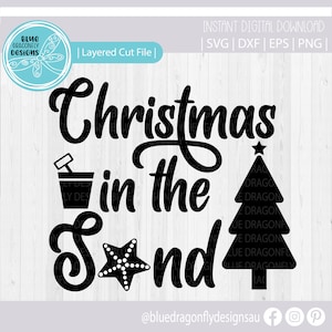 May include: Black and white digital cut file design for a Christmas in the Sand themed craft project. The design includes the text "Christmas in the Sand" with a Christmas tree, a bucket and spade, and a starfish.