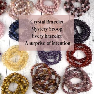 May include: An assortment of crystal bracelets in various colors, including pink, green, and brown. The bracelets are made of small, round beads and are arranged in circular patterns. Text on the image reads: Crystal Bracelet Mystery Scoop Every bracelet A surprise of intention.