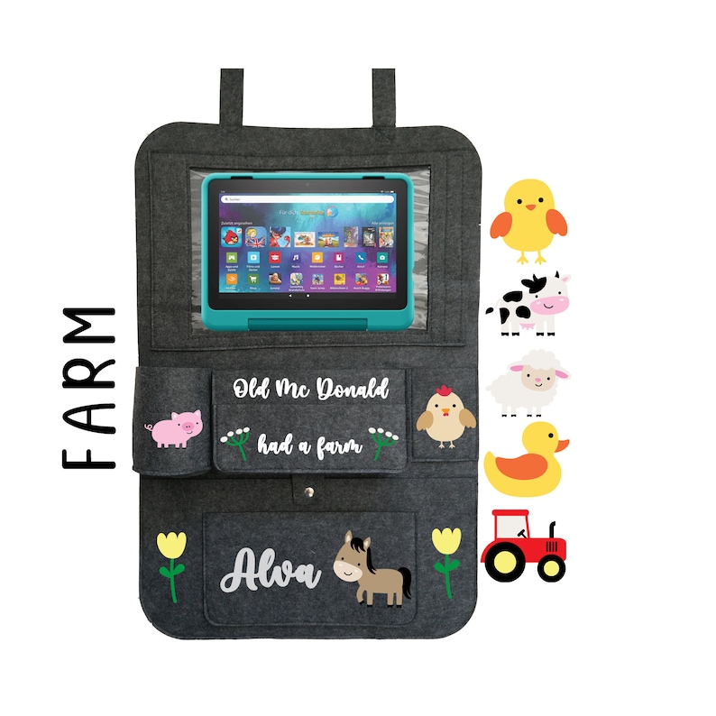 May include: Gray felt car seat organizer with a clear plastic window for a tablet. The organizer has pockets for storage and features a farm theme with embroidered animals, the text "Old Mc Donald had a farm", and the name "Alva".