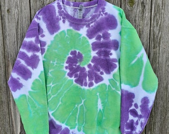 May include: A purple and green tie-dye sweatshirt with a spiral pattern.