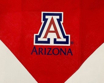 May include: Red bandana with a white and blue University of Arizona logo and the word "ARIZONA" in blue text.