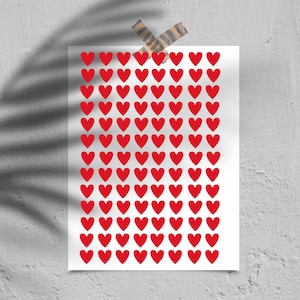 Op de afbeelding: Een wit vel papier met een raster van 100 rode harten.