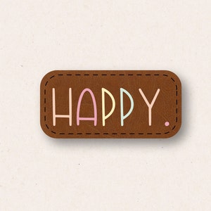 May include: A brown leather patch with the word "HAPPY" in pastel colors. The letters are pink, yellow, and blue. The patch has a stitched border and a small dot at the end of the word.