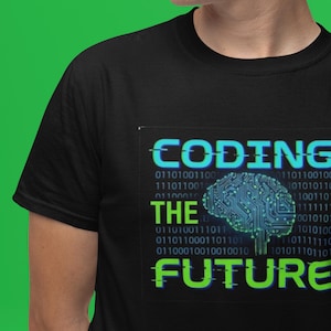 May include: Black t-shirt with a teal and green graphic that says "CODING THE FUTURE." The design includes a brain made of circuit board lines and binary code.