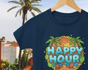 May include: Navy blue t-shirt with a colorful graphic that says "HAPPY HOUR". The design includes palm trees, beach chairs, and a tropical sunset. The shirt is hanging on a wooden hanger.