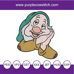 May include: An embroidered design of a cartoon character with a green hat and tan clothing, resting his chin on his hands. The character has a large red nose and a slight smile. The website address "www.purplecowstitch.com" is at the top.