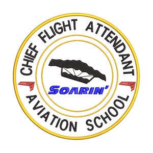 May include: A yellow and black circular patch with the text "Chief Flight Attendant Aviation School" around the edge. Inside the circle is a black silhouette of a hang glider with the text "Soarin'" in blue.