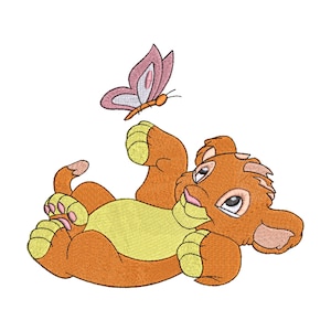 May include: A cartoon illustration of a brown and yellow lion cub lying on its back with its paws in the air. A pink butterfly with orange accents is flying above the cub.