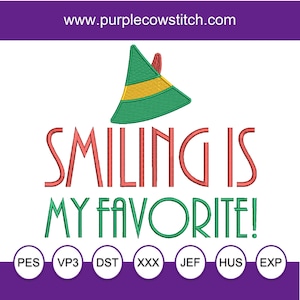 May include: Smiling is my favourite! Embroidery design featuring a green elf hat with a yellow band and red trim. The text is in red and green with a white outline. The design is available in PES, VP3, DST, XXX, JEF, HUS, and EXP formats.
