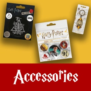May include: A set of Harry Potter themed accessories including a vinyl sticker pack, a badge pack, and a keychain. The sticker pack features a black and white image of the Deathly Hallows symbol. The badge pack includes five badges with various Harry Potter imagery. The keychain features a gold-colored Hogwarts crest.